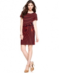 Calvin Kleins put a fresh spin on stripes, outfitting this short-sleeve dress with horizontal bands at the bodice and vertical through the skirt. The look is tied together with a drawstring waist and sleek zippered pockets.