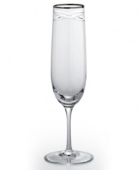 Commemorate a special anniversary with a simply elegant reminder of the time you said, I do. This radiant crystal flute is hand-engraved with interlocking bands that symbolize the rings exchanged between bride and groom. A platinum rim provides a graceful finish.