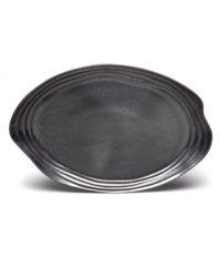 Down-to-earth dining. This Earth serving platter has a handcrafted feel with a fluid shape and steely sheen to complement the Nambe dinnerware collection.