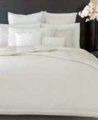 This Modern Classics White Gold sham from Donna Karan features plush texture and a soothing colorway for an impeccable addition to your bed. Finished with silk trim. Button closure.