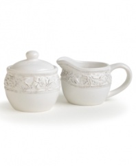 Bring a little old-fashioned romance to the table with Country Cupboard dinnerware. Featuring a rustic whitewash finish, border of embossed florals and delicate beading, the vintage-style sugar and creamer give casual tables a sense of femininity and grace.