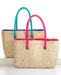 Carry all your provisions for a day at the beach in a stylish tote woven of natural rush. Vibrant poplin lining adds a splash of summer color and gives the classic style of the bag a fresh, modern accent.