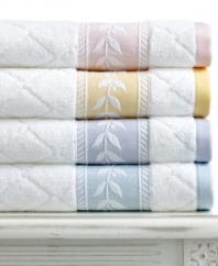 Crafted with pristine Martha Stewart Collection style, this Trousseau hand towel features a fresh white-on-white diamond pattern with embroidered leaf trim for a truly elegant appeal. Finished in pure cotton.
