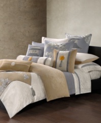 Quilted with iconic wave motifs inspired by ancient Eastern textiles, the Lotus Temple quilted coverlet presents luxurious comfort in soothing color.