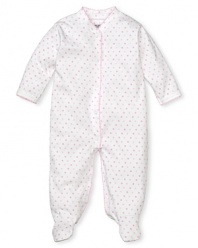 A pink polka dot footie with a snap front and contrast scalloped edge trim.