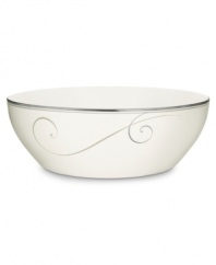 Fluid platinum scrolls glide freely throughout this beautiful fine china round vegetable bowl from Noritake. Easy to match with any decor, the fresh and elegant Platinum Wave collection of dinnerware and dishes is a timeless look for fine dining or luxurious everyday meals. Holds 96 oz.