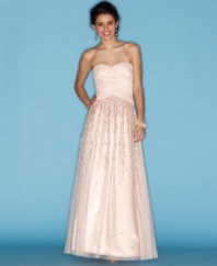Sparkle, princess style, in this gown from Hailey Logan that pairs a structured top with a flowing, voluminous skirt!