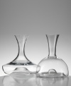 Marrying the finest modern innovations with graceful contemporary style, this dramatic decanter (shown left) is a lavish treat for any wine. An inward curved base allows carafe to be gripped from the body for ease of pouring, while Eisch's trademarked No Drop Effect© keeps wine from dripping outside the decanter. Holds 50 oz. (Clearance)
