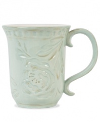 Sculpted blooms and a classic silhouette make the Toulouse mug by Fitz and Floyd a charming part of any casual landscape. A rustic green glaze adds to its antique appeal.