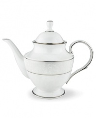 This elegant teapot is accented with a delicate flourish of vine-like, white-on-white imprints with raised, iridescent enamel dots. Holds 40 oz. From Lenox's dinnerware and dishes collection. Qualifies for Rebate