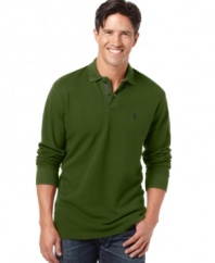 Stock up on casual staples like this subtly textured pique polo shirt from Izod and wear it all season long. (Clearance)