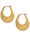 Sculpturally stylish. Kenneth Cole New York puts an artsy spin on a traditional pair of hoop earrings. Oval-shaped hoop earrings crafted in gold tone mixed metal. Approximate drop: 1 inch.