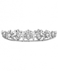 Head of the class. Add a refined, regal look to your special-occasion style with this elegant tiara from Monet. Adorned with sparkling Swarovski crystals, it's set in silver tone mixed metal. Approximate diameter: 5-1/2 inches (curved).