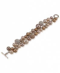 Get glam with this gold cluster bracelet from Carolee. Bracelet features gold glass pearls and crystallized fireballs set in 12k gold-plated mixed metal. Toggle and bar closure. Approximate length: 8 inches.