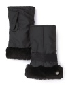 A genuine shearling trim lends a plush finish to these fingerless gloves from UGG® Australia.