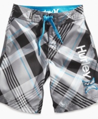 A silver lining. No matter if he's playing in the sun, sand or water, he'll always have something to smile about in these board shorts from Hurley.