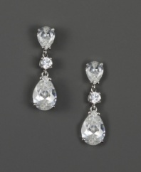 Indulge in the finer elements of style. These gorgeous drop earrings by Givenchy feature sparkling round and pear-cut cubic zirconias (14-5/8 ct. t.w.) set in silver tone mixed metal. Approximate drop: 1-1/2 inches.