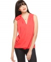 Decorated with a fabric flower, RACHEL Rachel Roy's top brings new life to a relaxed surplice silhouette.