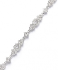 Treat yourself to a little luxury. Eliot Danori's dramatic Diadem Bracelet features a unique diamond-shaped crisscross pattern accented by sparkling crystals. Crafted in silver tone mixed metal. Approximate length: 7-1/4 inches.