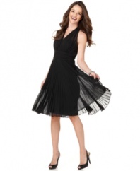 You're sure to look red-carpet ready in this pleated halter dress by Evan Picone. The silhouette says Hollywood and begs to be taken for a twirl on the dance floor.