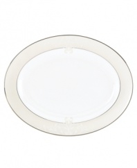 Refine your formal table with classic cream and white Lenox dinnerware. Dishes, including this Opal Innocence Scroll bone china oval platter, are trimmed in platinum and accented with a raised dot and scroll pattern, bringing contemporary grace to special occasions. A pearlized finish adds subtle shimmer. Qualifies for Rebate