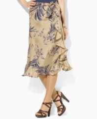 Skirt Hand-painted with a large floral pattern, Lauren by Ralph Lauren's flowing silk skirt is crafted in a ruffled sarong silhouette.