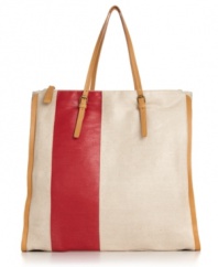 The perfect take-anywhere tote. This understated design from KDNY by Kelsi Dagger adds a pop of color to a simple silhouette for a style that will last for seasons to come.