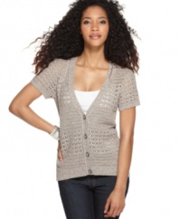 Allover marled knit stitches lend a homespun look to this chic cardigan from DKNY Jeans. Pair it with a cami and jeans for a laid-back ensemble.