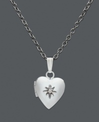 A timeless keepsake in silver. This children's heart locket features a central diamond accent. Set in sterling silver. Approximate length: 13 inches. Approximate drop: 1/2 inch.