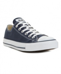 An undisputed classic, these Converse men's sneakers are first in sports, first in fashion. With a canvas upper, cap toe and rubber sole. Imported.