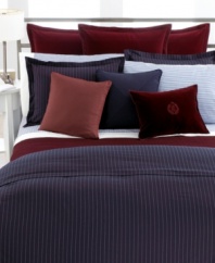 Woven of pure cotton in a chic navy hue with chalk stripes, the Greenwich Modern bedskirt from Lauren Ralph Lauren lends sophistication to any bedroom.