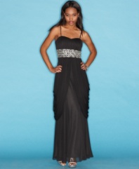 Party in grand style with this gown from B Darlin that's gorgeously jeweled and draped to perfection!