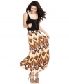 Join the season's maxi revolution with this floor-sweeping skirt from Sugar & Spice! The bold tribal print makes this style a trend-right piece for every day wear!