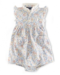 A delicate arrangement of flowers adorns this adorable sleeveless dress in breathable cotton mesh.