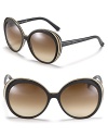 Chic retro-inspired round sunglasses with etched frames from Alexander McQueen.