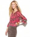 A tribal print gives INC's peplum peasant top a boho-glam look! Pair it with dramatic earrings for the finishing touch.