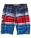 Off the grid. He'll hit the waves with uncharted style in these plaid board shorts from Quiksilver.