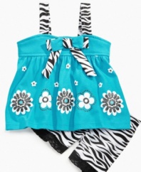 Uncage her wild side with fun style in this zebra-print tank and short set from Nannette.