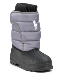 A breathable all-weather boot with a quilted waterproof upper, embroidered horse logo, cozy fleece lining and side Velcro® closure.