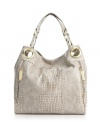 Add some interest to your everyday look with this gorgeous snakeskin print design by Steve Madden. Polished goldtone hardware and unique side zip detailing add the perfect finishing touches.