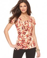 In a fiery abstract print, this ruched Alfani top adds a splash of bold color to any outfit!