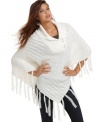 Perfect for layering over a lightweight knit, pair this poncho from Say What? over your favorite fall tops for a look that never goes out of style.