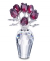 Add a touch of romance to your home with the Swarovski Red Roses. Seven ruby-red roses, crafted of sparkling Swarovski crystal with rhodium stems are set in a multi-faceted vase. 2-5/8 H x 1-5/8 D.