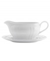 An elegant way to serve delicious homemade gravy and sauces, this gravy boat from Mikasa's Antique White dinnerware and dishes collection has a soft geometric feel and clean, embossed design. Platter included to catch any drips.