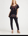 Gorgeous embroidery makes this tee stand out from the rest. Its elongated silhouette will be perfectly flattering for your figure.ScoopneckDolman sleevesAbout 33 from shoulder to hemCottonMachine washImported