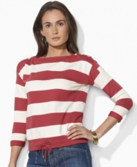 Infused with nautical inspiration, Lauren Jeans Co.'s essential French terry pullover features bold stripes, three-quarter sleeves and anchor-embossed buttons for seaworthy style.