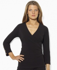 Lauren by Ralph Lauren's slinky matte jersey creates a figure-flattering faux-wrap design, tailored with three-quarter sleeves and anchor-embossed buttons for a hint of seaside chic.