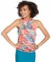 Feminine ruffles unite with a rainbow of print on a halter top from BCX that awakens your bottoms with colorful style!