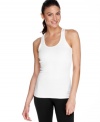 This ribbed tank top in a longer length provides breathable comfort and total coverage during your toughest workouts, from Puma. The built-in shelf bra provides support for low-impact activities, too!