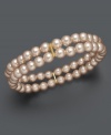 Elevate your look with shimmery pastels. This Charter Club bracelet features two rows of pink simulated plastic pearls crafted in mixed metal. Bracelet stretches to fit wrist. Approximate diameter: 3-1/2 inches.
